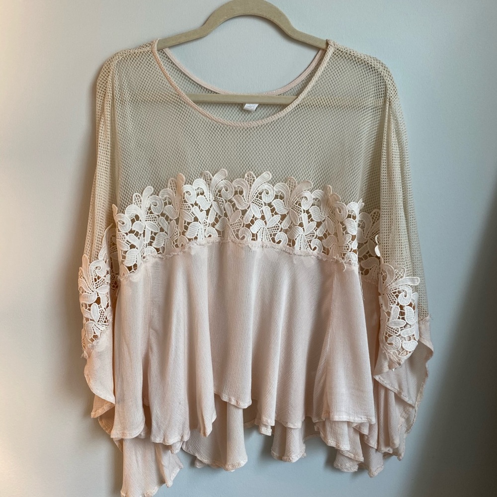 Boho chic cream blouse with lace detail!